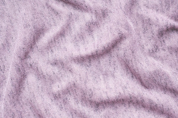 The texture of the purple fabric. Background of clothing details.