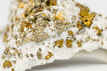 The Chalcopyrite (CuFeS2) contains Copper, Iron and Sulfur here in combination with Quartz
