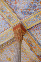 Beautiful antique wooden pillar and ceiling at the entrance of ancient Persian Chehel Sotoun. Isfahan, Iran.