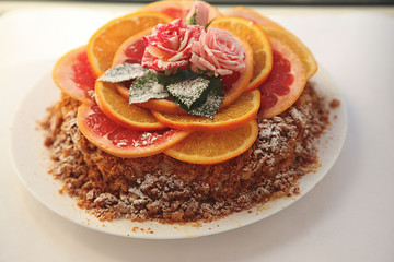  Homemade cake / cheesecake with orange, lime and chocolate. Decorated with flowers