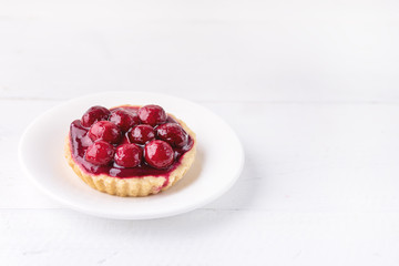Fresh Homemade Tartlets Tart with Berries on White Background Tasty Tarts Decorated with Red Berries Horizontal Copy Space