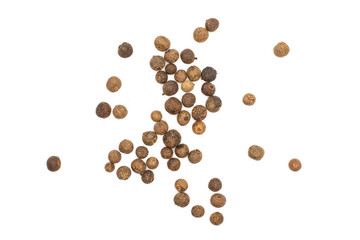 Lot of whole dry brown allspice berries flatlay isolated on white background