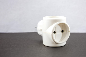 white adapter on a gray background