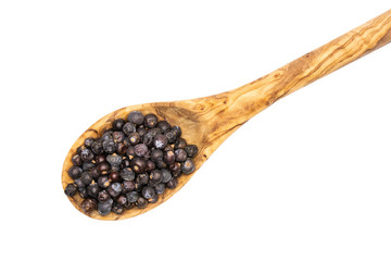 Lot of whole dry juniper berry seed flatlay isolated on white background