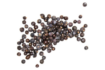 Lot of whole dry juniper berry seed flatlay isolated on white background