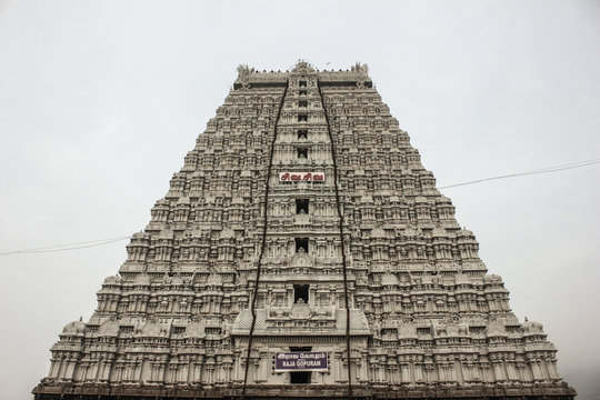 Thiruvannamalai temple's Raja Gopuram front side low angle view with a cloudy sky in the background. 