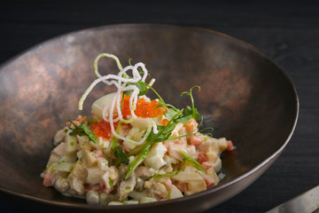 Traditional Russian Christmas and New Year's salad Olivier. Selective focus. close-up. horizontal view of salad.