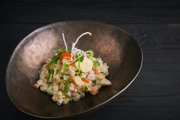 Traditional Russian Christmas and New Year's salad Olivier. Selective focus. close-up. horizontal view of salad.
