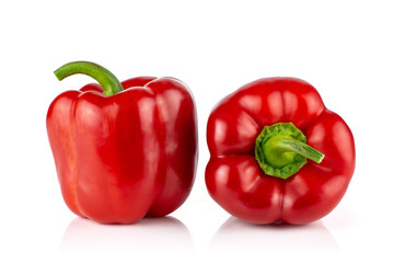 Group of two whole bulgarian red bell pepper isolated on white background
