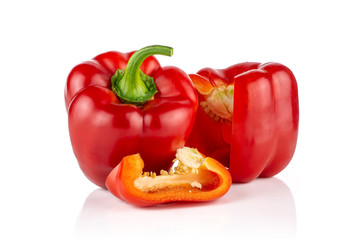 Group of two whole one slice of bulgarian red bell pepper isolated on white background