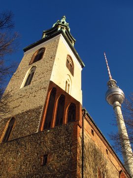 Berlin Germany St. Mary’s Church and TV Tower with blue sky