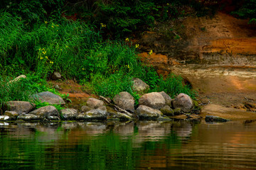 Landscape with river, cliff  and rocks in Latvia.