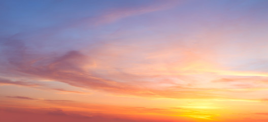 Fototapeta Majestic real sunrise sundown sky background with gentle colorful clouds obraz