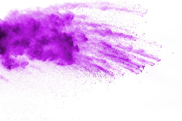 Fototapeta na wymiar Purple color powder explosion cloud on white background.Closeup of purple dust particles splash on background.