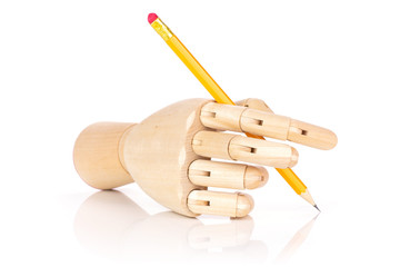 One whole yellow pencil in a wooden mannequin hand isolated on white background