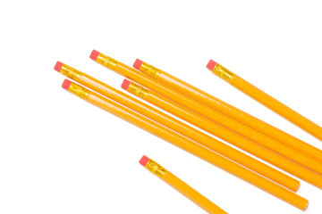 Group of seven whole yellow pencil flatlay isolated on white background