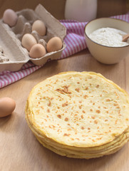 crepes preparation concept with ingredients on tabletop