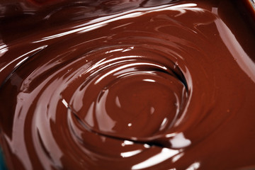 Melting chocolate, melted delicious chocolate for handmade praline icing confectionery