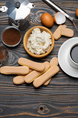 Ingredients for cooking tiramisu - Savoiardi biscuit cookies, mascarpone, cream, sugar, cocoa, coffee and egg