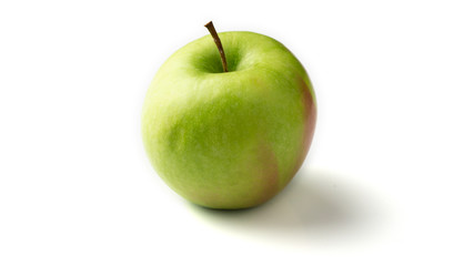 Pomme verte entière sur fond blanc