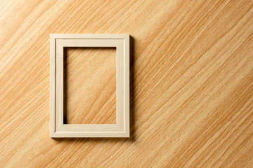 empty classic wooden photo frame on wooden desk.