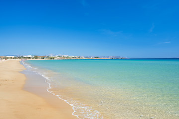 Sandy beach with amazing tranquil water on Paros island, Greece.