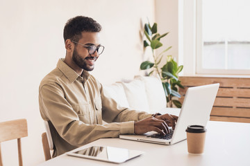 Men student working on computer. Businessman using laptop at home. Internet marketing, freelance...