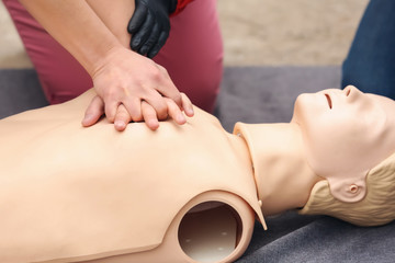 Man learning to perform CPR at first aid training course