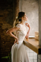 Fototapeta premium The woman in the dress thought. Advertising wedding dresses