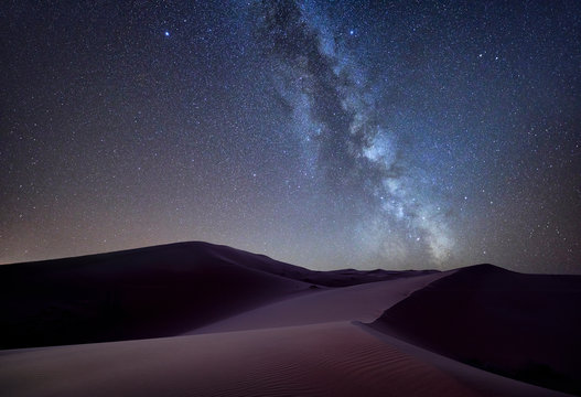 Morocco, Merzouga desert, Milky way over sand dunes