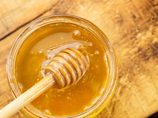 honey with wooden mixer top view