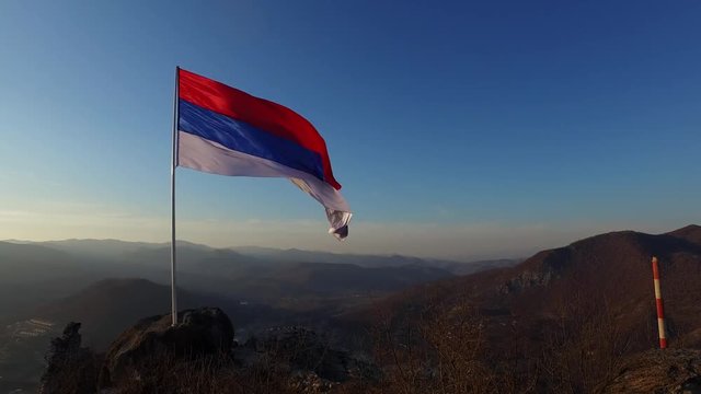 Serbian Civil Flag on Strong Wind on Top Of Zvecan Fortress in Mitrovica Kosovo