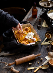 Homemade cinnamon pumpkin rolls in baking pan
