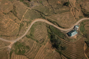 top view road and dry forest on mountain . part of way among forest at rural