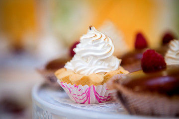 cupcake decorated with white cream close-up