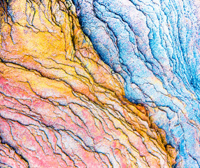 Colourful sedimentary rocks formed by the accumulation of sediments – natural rock layers backgrounds, patterns and textures - abstract graphic design – geology – nature formations
