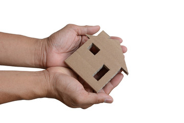 holding a cardboard house isolated on white background, crisis concept, homeless.