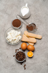 Ingredients for cooking tiramisu - Savoiardi biscuit cookies, mascarpone, cheese, sugar, cocoa, coffee and egg