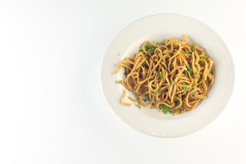 Stir fried noodles with Peanuts and vegetables in white plate