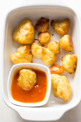 Cauliflower popcorn, coated mini cauliflower florets in a light batter with a spicy Buffalo dip