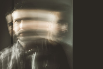Blurred movement effect man in motion.Portrait of a guy