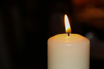 Burning paraffin light close up on dark background