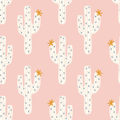 vector seamless cactus pattern with white cactus and golen blooms on a pink background