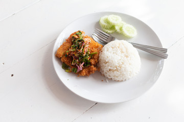 Fried fish spicy salad served with rice