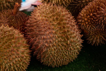 close up yellow thai durian on grass in market
