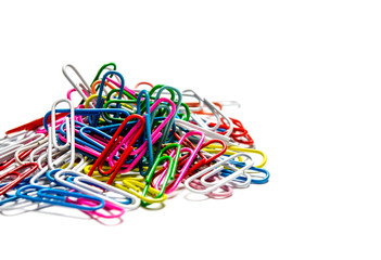 Colorful paper clips to documents lying on a white background