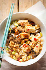 Sticky teriyaki tofu with rice, edamame beans and red chillies
