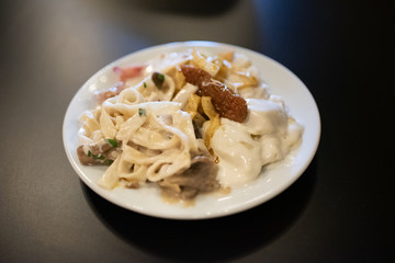 Italian pasta dish with carbonara sauce.