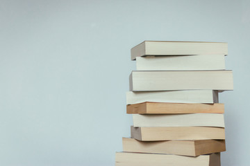 Literature for study: Stack of books; grey background