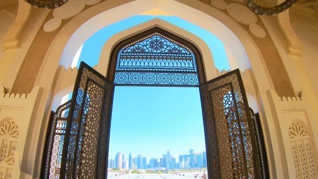 Decorated entrance gate of Grand Mosque in West Bay area, Doha in Qatar. Qatar State Mosque in arab style, Middle East, Arabian Peninsula. Evening sky.